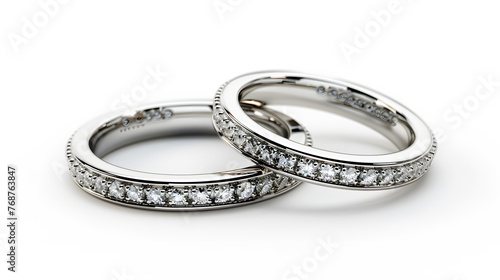 A Pair of Diamond Platinum Rings on White Background