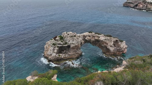 Calas de la isla de Mallorca en España, el mar azul en el mediterraneo, playas rocosas y acantilados que resaltan en el paisaje photo
