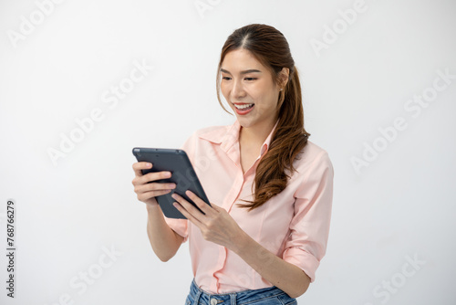 Digital Communication: Asian Woman Holds Touchscreen Tablet on White Background, Embracing Connectivity in Modern World