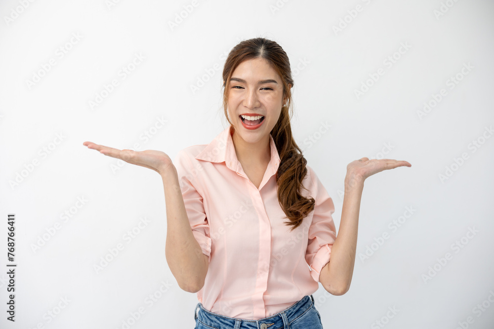 Presentation Concept: Asian Woman Demonstrating Gesture, Pointing to Space on White Background, Creative Expression of Ideas Presentation Concept: Asian Woman Demonstrating Gesture, Pointing to Space on White Background, Creative Expression of Ideas