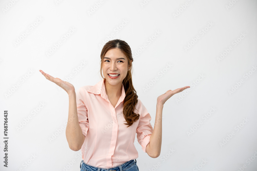 Presentation Concept: Asian Woman Demonstrating Gesture, Pointing to Space on White Background, Creative Expression of Ideas Presentation Concept: Asian Woman Demonstrating Gesture, Pointing to Space on White Background, Creative Expression of Ideas