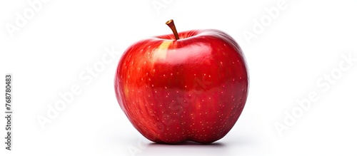 A single red apple with a g...