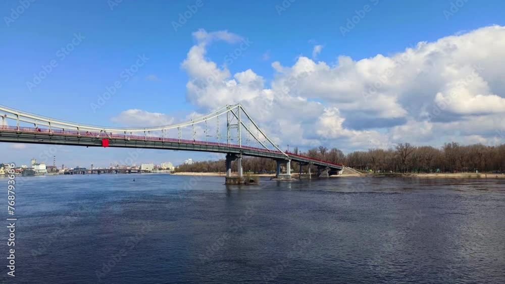 Pedestrian bridge in Kyiv in sunny spring day Pedestrian bridge in Kyiv in sunny spring day