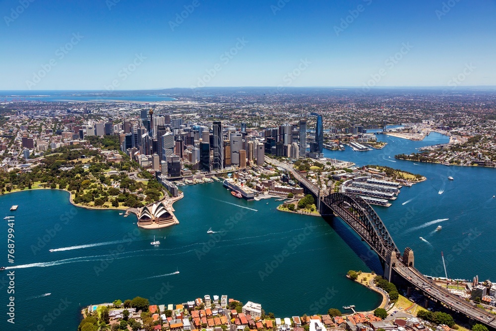 Naklejka premium an aerial view of sydney with the harbor and city centre in the distance
