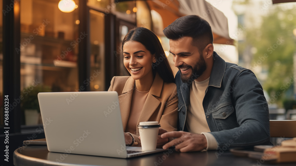 Couple who is shopping and paying with a credit card Online shopping on a laptop Couple who is shopping and paying with a credit card Online shopping on a laptop