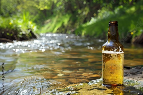 halffilled bottle with clear spring stream running in background