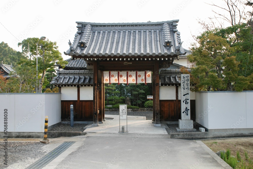 this chinese building is set on the street in front of an asian house this chinese building is set on the street in front of an asian house