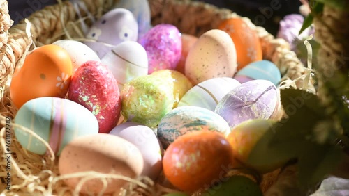 colorful Easter eggs in a wicker basket photo