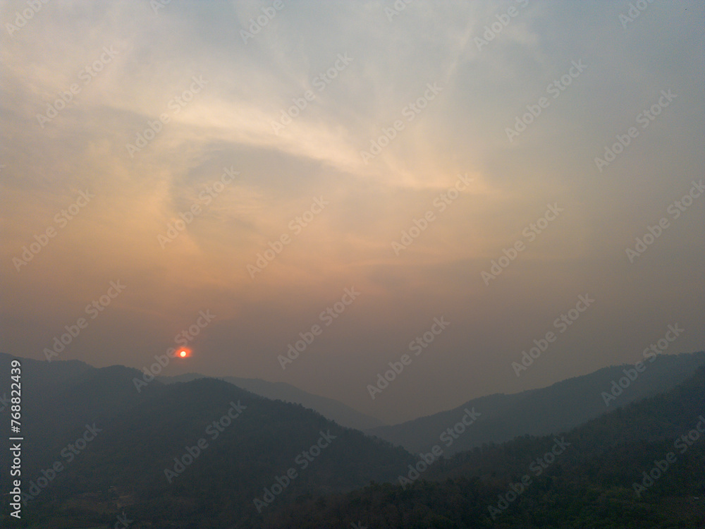 Fototapeta premium High-angle landscape Toxic dust covered Mountains and sky that are hazy at sunset