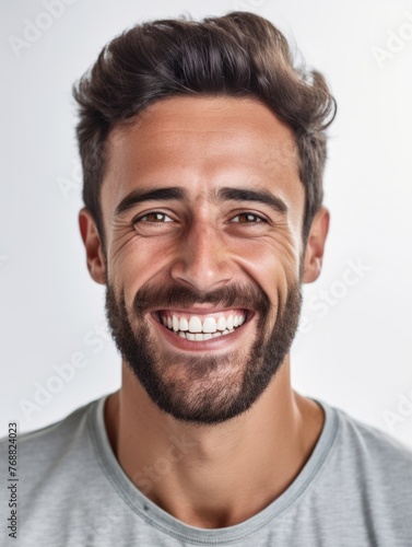 A portrait of a smiling man with a beard and white teeth © StasySin