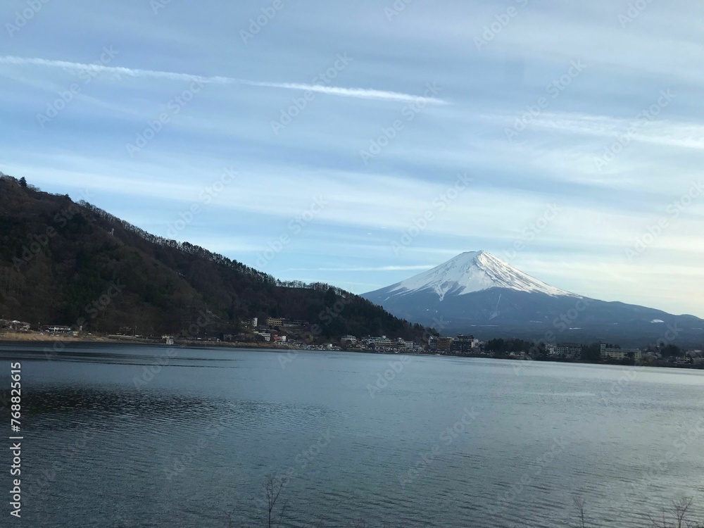 Scenic view of Mount Fuji with a tranquil body of water in the foreground. Japan.