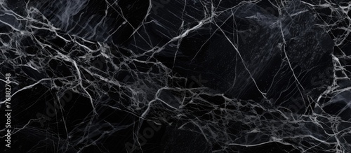 The black and white marble texture serves as a luxurious backdrop for interior design  such as kitchen floors  worktop counters  walls  and flooring. Its intricate patterns and sleek finish add a