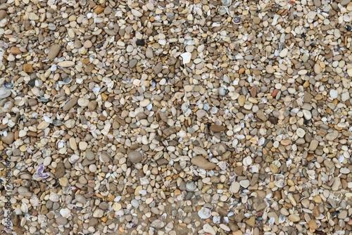 Gravel bed featuring a mix of brown, white and black rocks
