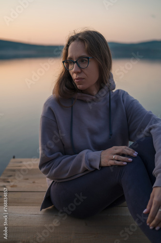 Woman sitting on the pier