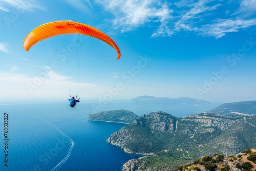 Happy paragliders flying on a paraglider, aerial view of flying paragliders © serz72