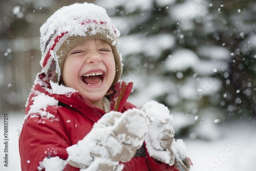 laughing child with snowcovered gloves