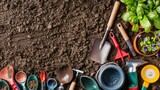 Various gardening tools and healthy potted plants are arranged on rich, dark soil, ready for planting and nurturing.