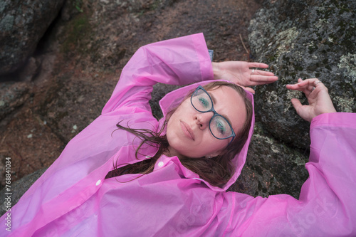 Woman in the taiga forest and rocks of the Stolby nature reserve park photo