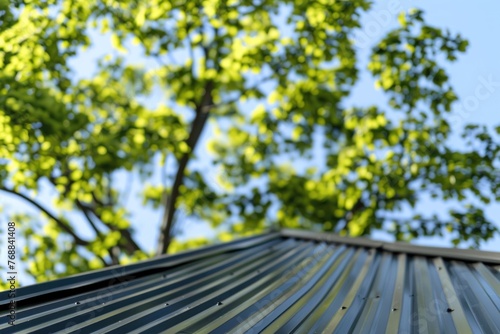 new metal roof with green tree on background photo