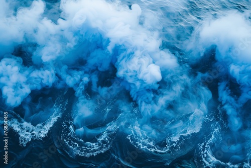 blue smoke over water creating a wave effect