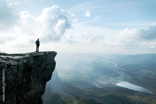 Person standing at the edge of a cliff