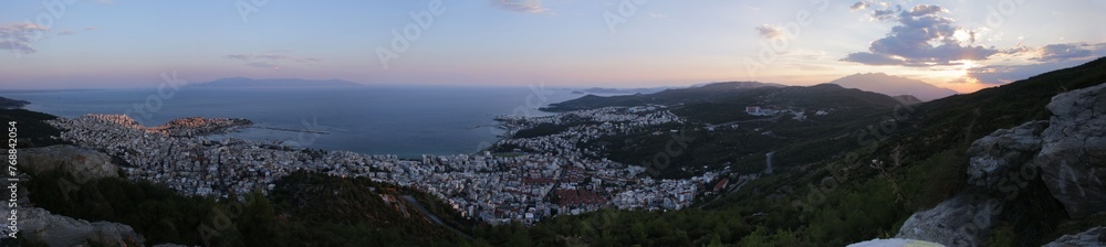 Stunning view of the sea and the coastal city of Kavala, Greece at sunset