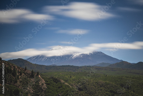 Teide volcano covered by snow under the clouds