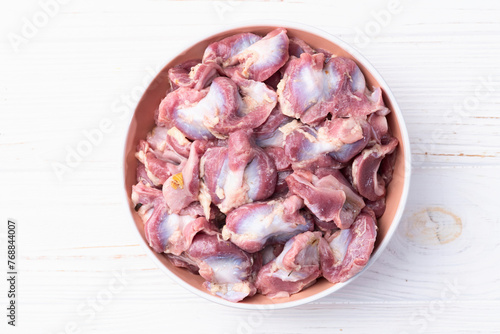 Raw chicken giblets gizzard ( stomach ) , meat background