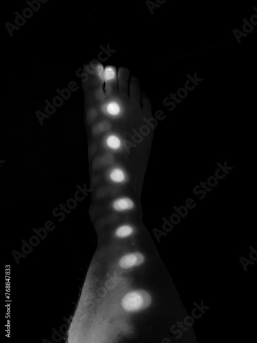Man Leg and Foot with Illuminated Light Dots in Switzerland.