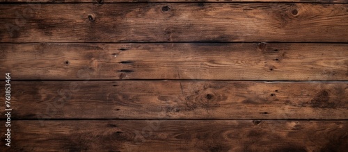 The weathered wooden wall shows signs of age and wear, with a distinct brown stain running through the grain. The texture adds character to the wall, hinting at years of exposure to the elements.
