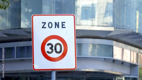 Zone 30 road sign, indicating the limit zone of thirty kilometers per hour for cars and other vehicles photo