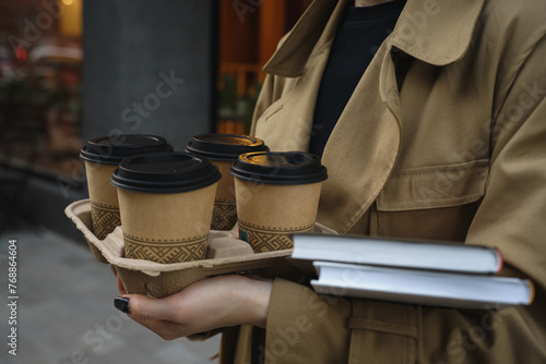 Take away coffee cups and books