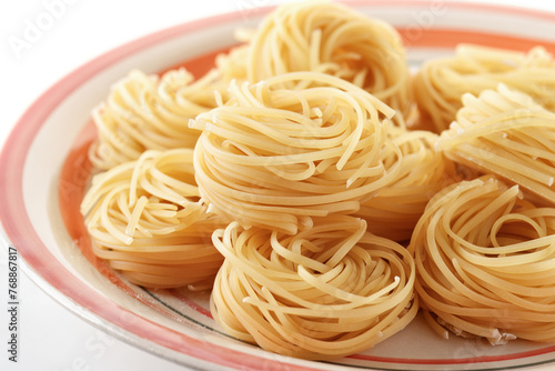 Uncooked tagliolini pasta nests