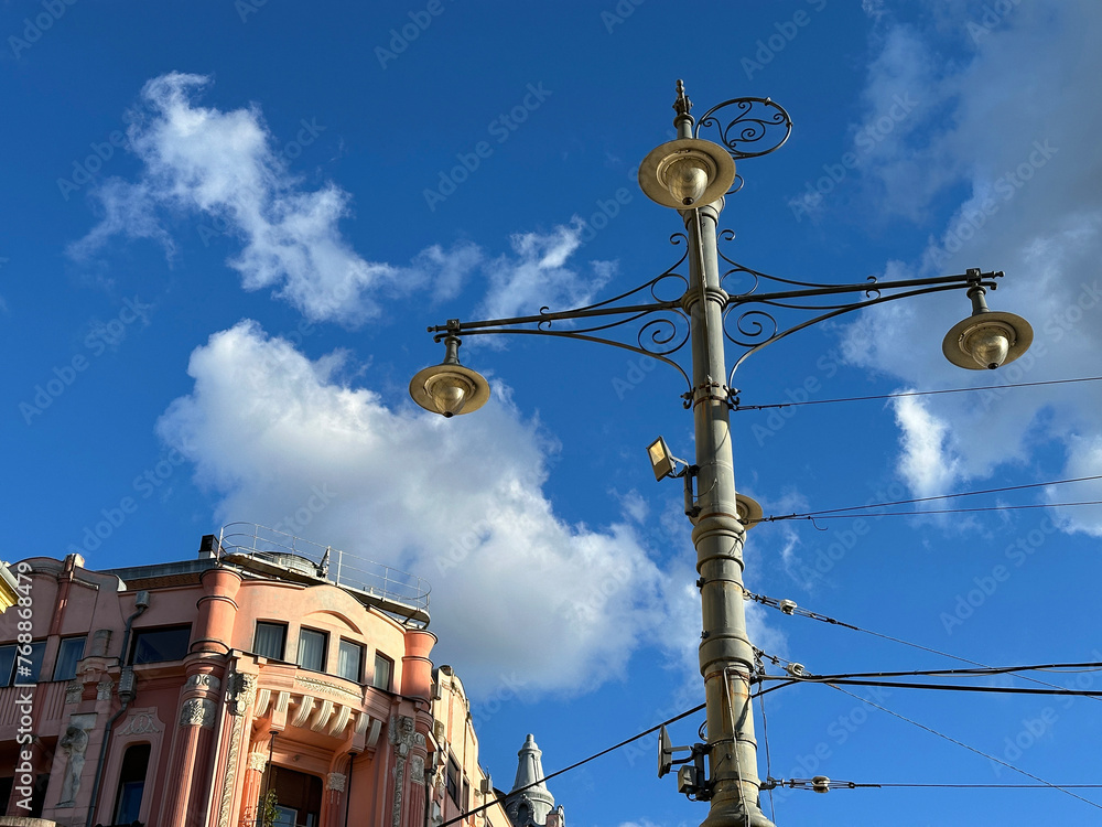 Street lights against blue sky