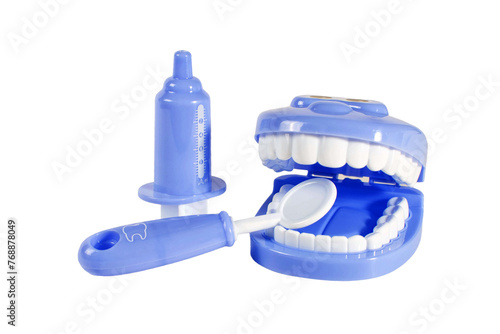 A blue toy dental set with a toothbrush and a syringe