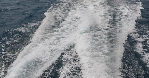 Ship wake up in the ocean. aves from the back of a speed boat over the water's surface in the sea. Waves behind a boat on a clear blue sea