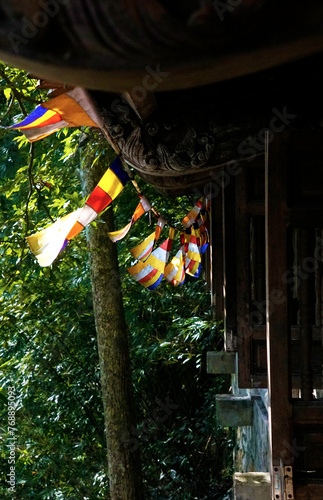 Flags hanging along the roof of the Mot Mai Temple in Yen Tu, Vietnam
