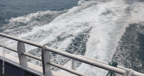 Ship wake up in the ocean. aves from the back of a speed boat over the water's surface in the sea. Waves behind a boat on a clear blue sea