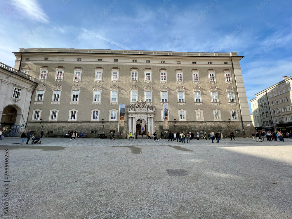 Fototapeta premium Salzburg, Austria - Nov 1 2023: View of the DomQuartier building from Residenzplatz in Salzburg, Austria. Showcasing historic architecture, ideal for themes of travel, history, and culture.