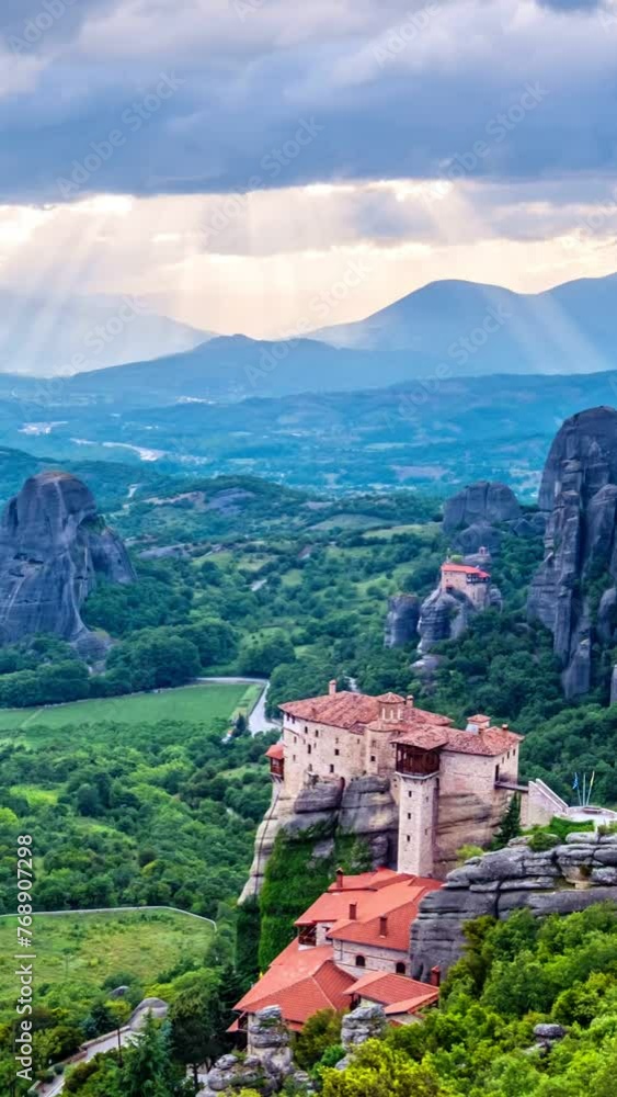 Timelapse of sunrise over monastery of Rousanou and Monastery of St. Nicholas Anapavsa in famous greek tourist destination Meteora in Greece