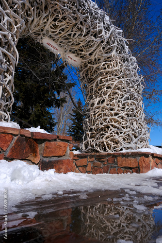 Antler Arch in Jackson Hole Wyoming Landmark Reflection in Melting Snow Water