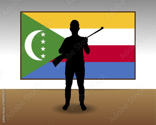 Man holding a gun in front of Comoros flag, fight or war idea