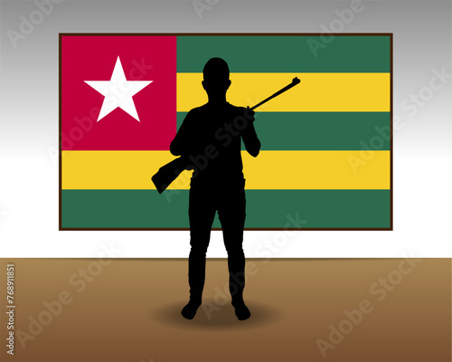 Man holding a gun in front of Togo flag, fight or war idea