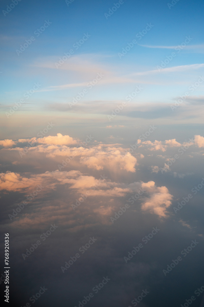 Clouds and blue sky background view from airplane