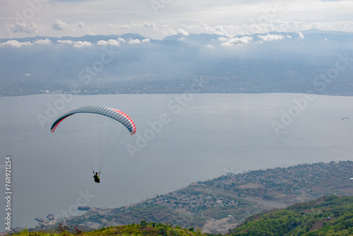 Paragliding soars at salena peak, palu city, Central sulawesi.