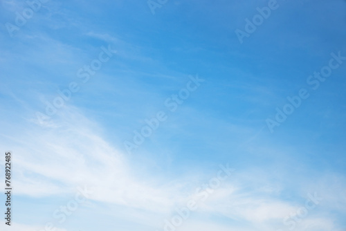 bright blue sky with feathery clouds, slight color differences
