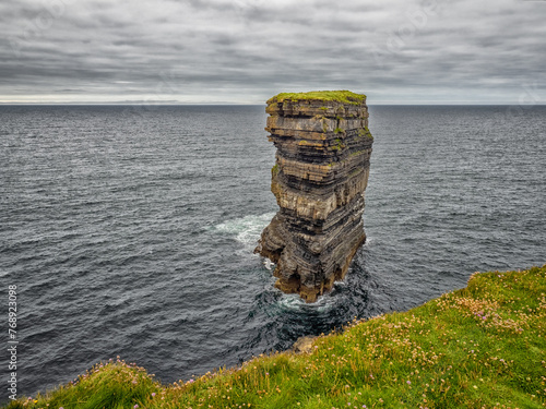 Dun Briste Sea Stack - Giant Rock Protruding From Ocean photo