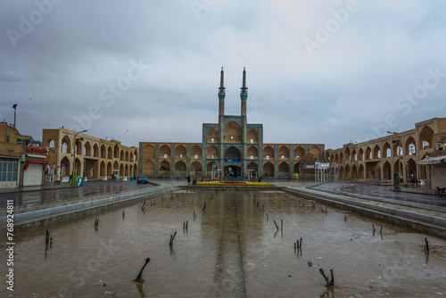 The Amir Chaghmagh mosque and plaza in Yazd, Iran on a rainy day. photo