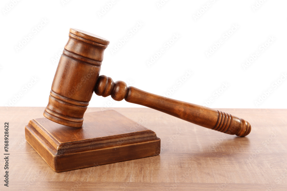 Gavel on wooden table against white background. Small mallet