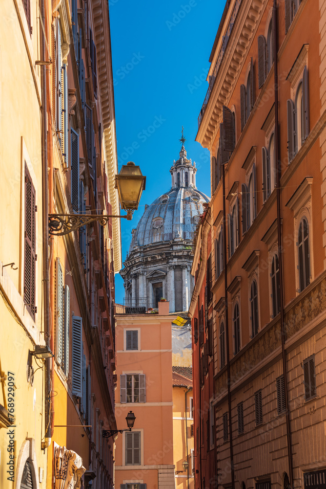 a roman perpective with the cupola of Sant' Andrea della Valle at the end of the street